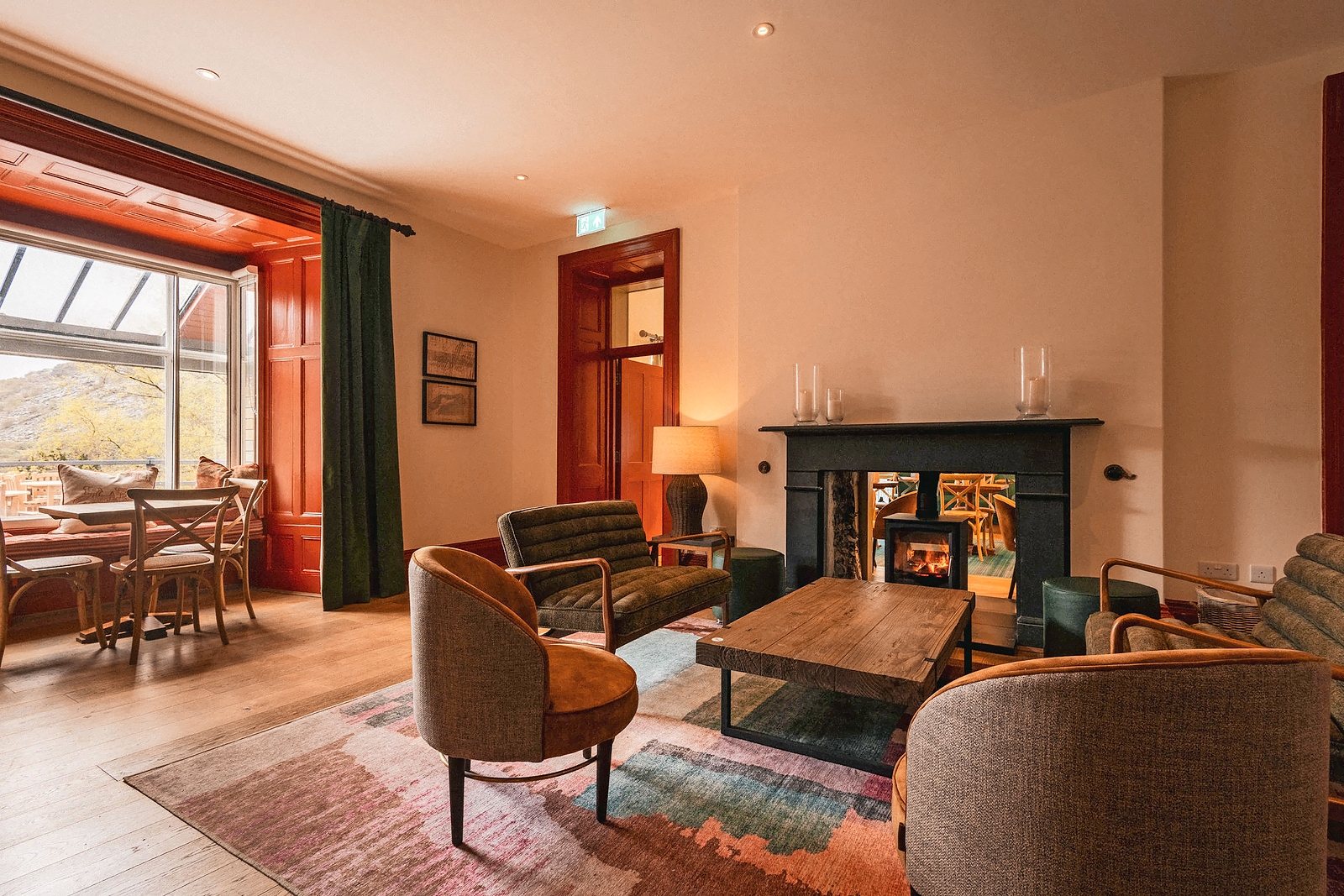 Inviting lounge area with fireplace at Plas Weunydd.
