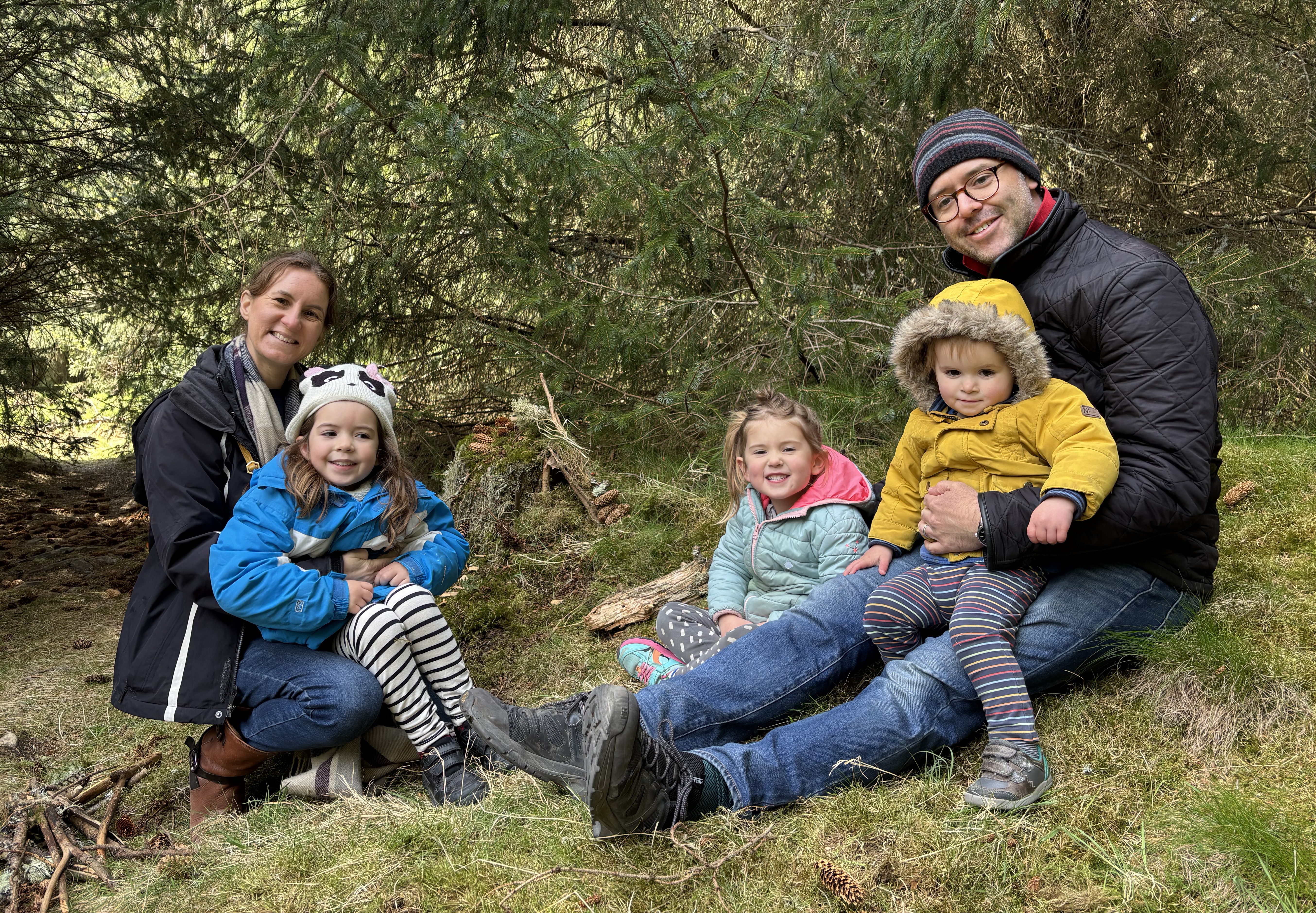 Family portrait in a forest.