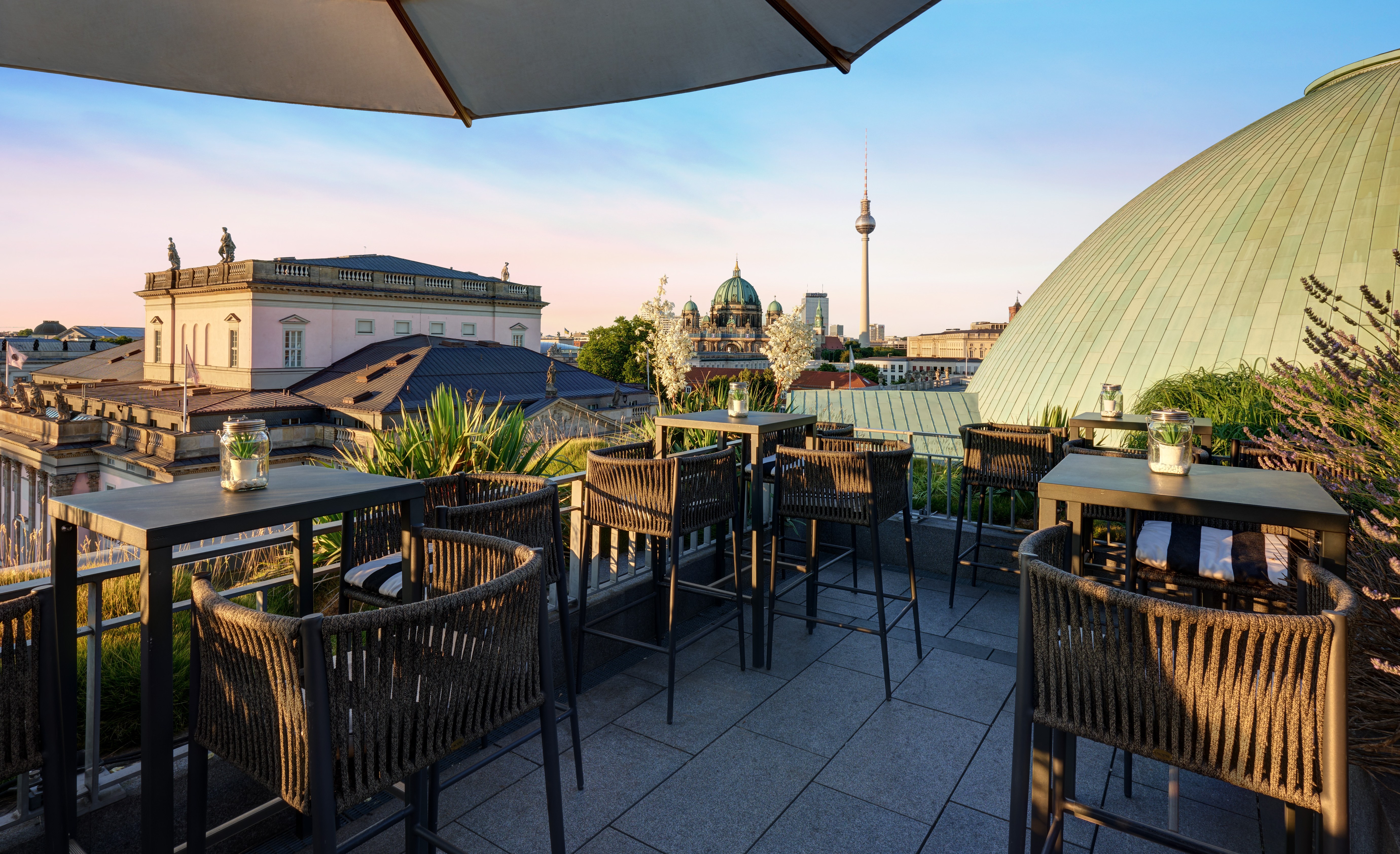 Rooftop terrace at Hotel de Rome overlooking Berlin's skyline.