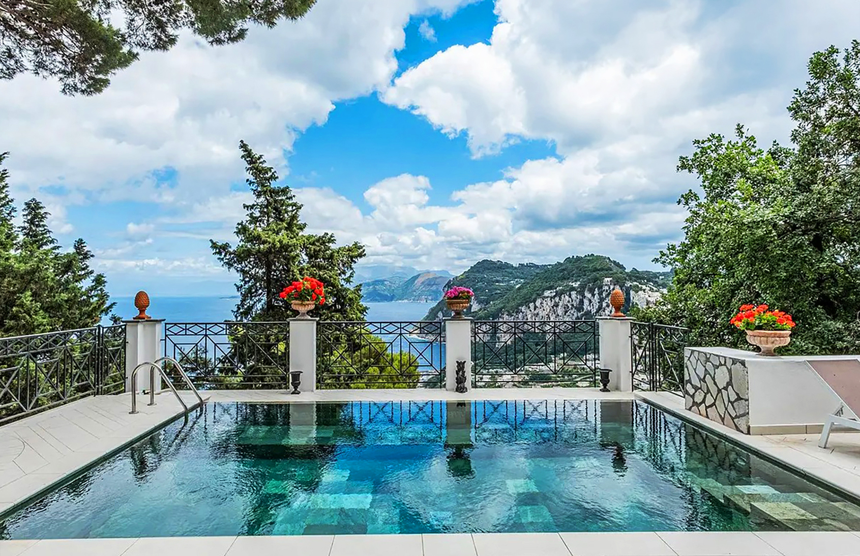 An outdoor pool with a view of the coastline at Villa Platani, Capri, one of the best villas in Italy with a pool